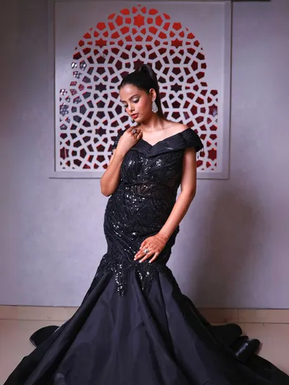 Another full-length view of the black fish-cut gown, a timeless and elegant choice.
