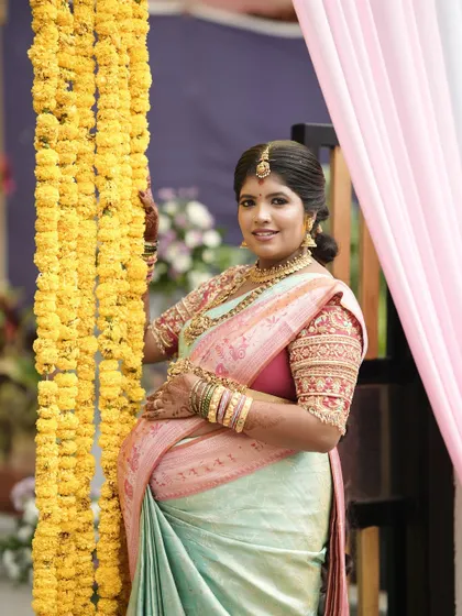 A beautiful portrait of the mother-to-be, her custom blouse adding a touch of elegance to this special celebration.
