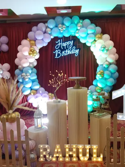 Another angle of Rahul's first birthday party, showing the picket fence and pampas grass details.