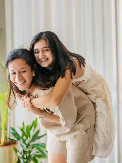 A fun piggyback ride in the living room! These sessions are all about capturing the playful, energetic moments that make your family unique.