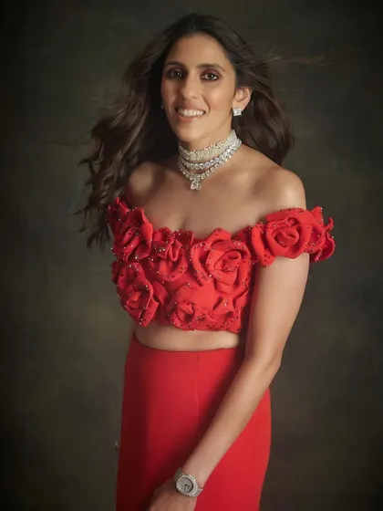 A smile that says it all. Shloka looking radiant in her red Valentino gown, a look we conceptualized for a very special evening. It's all about finding that one piece that feels just right.