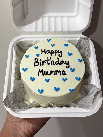 A sweet and simple bento cake for a mother's birthday, with "Happy Birthday Mumma" and little blue hearts.