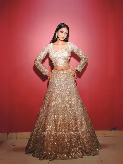 A final full-length view of the stunning golden lehenga.