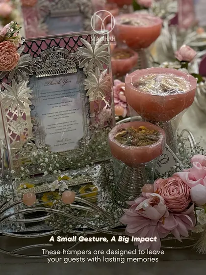 Designed to leave lasting memories, this pastel pink hamper combines a silver frame, dry fruit bowls, and sweets on an elegant silver-plated tray. It's the perfect way to express gratitude to your guests.