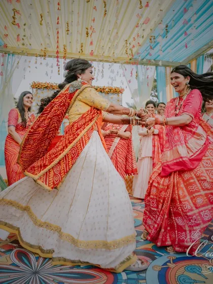 Two women performing the traditional Fugdi dance with incredible energy and grace.