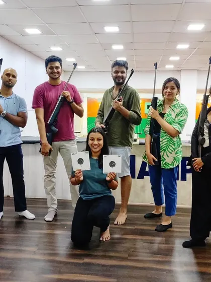 A one-time experience session is a great way to have fun with friends. Here's a group showing off their targets after a session of friendly competition and learning.