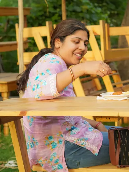 A guest enjoying a snack at our farm cafe during an evening event.