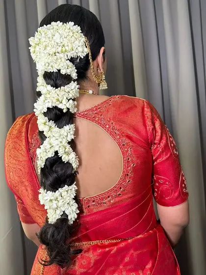 The full back view of the traditional South Indian floral braid. It's a masterpiece of hairstyling that smells as beautiful as it looks.