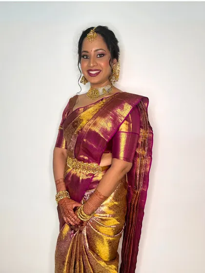 This look celebrates the beauty of South Indian traditions with golden hues and bold kajal. The makeup is designed to be both classic and glamorous.