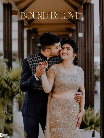 "Bound by Love." A romantic moment where Shubham gently kisses Airika's cheek during their engagement shoot.