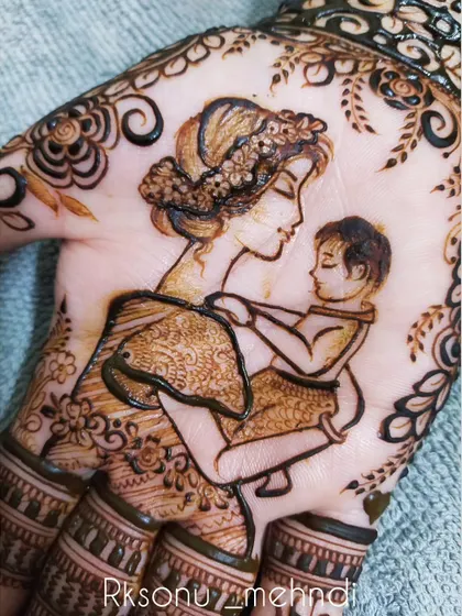 This whimsical design tells the story of a mother's love. One hand features a mother holding her child, while the other shows a baby peacefully sleeping in a cradle, surrounded by delicate floral and leaf patterns.