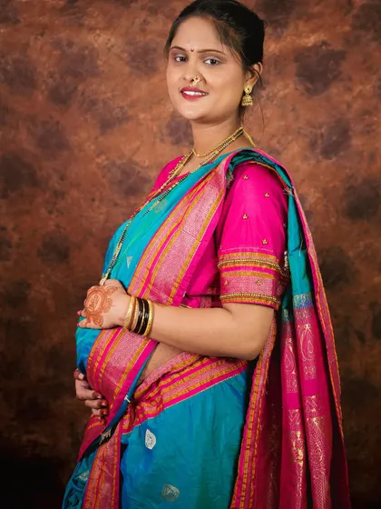 A beautiful portrait of a mom-to-be in a traditional saree. The joy and anticipation are so clear on her face.