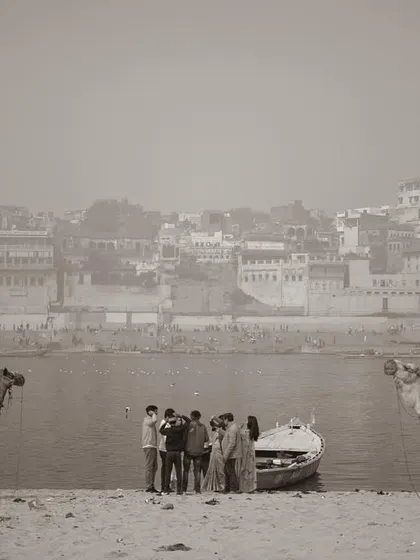 A sepia-toned image of camels on the banks of the Ganga, with the city's ancient architecture in the background. This photo creates a timeless, almost surreal landscape.