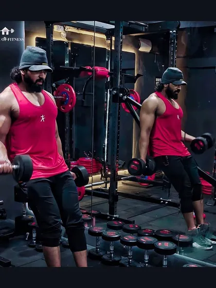 Building new dreams is easy, making them come true takes effort. Here I am doing dumbbell curls in my personal training studio, House of Fitness.