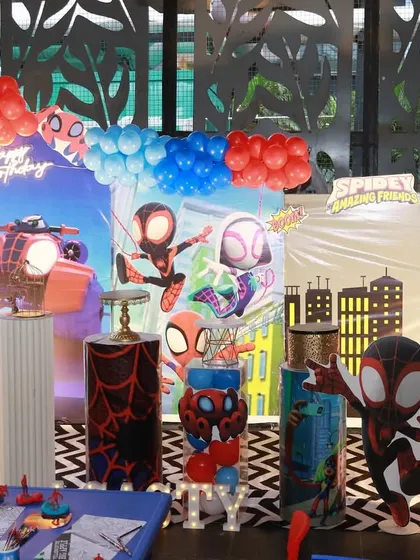 A fun Spider-Man themed party with character cutouts from the Spider-Verse.