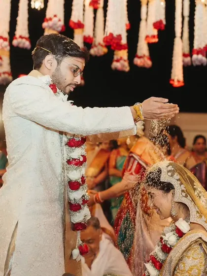 Another angle of the Talambralu, capturing the groom's participation in this joyful ritual.