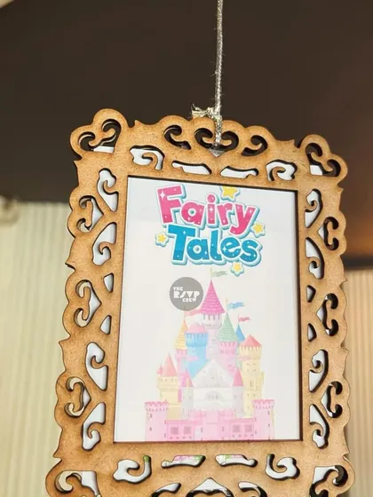 Another hanging frame with a 'Fairy Tales' castle graphic, adding to the magical storybook atmosphere.