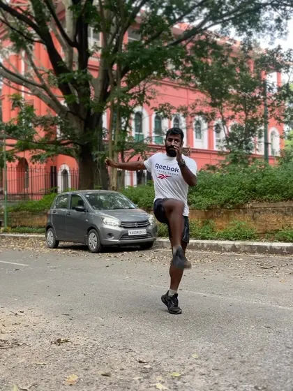 A hip opener drill, 'out to in', to improve mobility and range of motion in the hip joint. This is a key pre-run exercise.