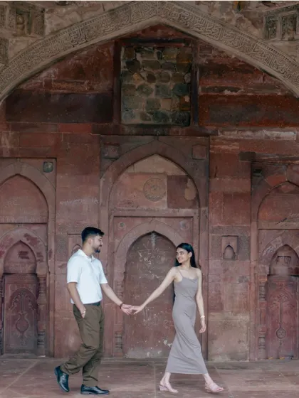 Leading the way through history. This shot at a heritage site in Delhi captures a sense of journey and togetherness, framed by the beautiful rustic textures of the past.