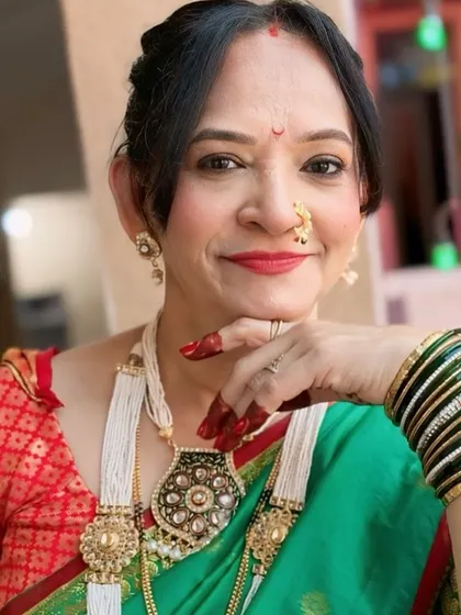 A beautiful portrait showcasing the traditional jewellery and the soft, glowing makeup.