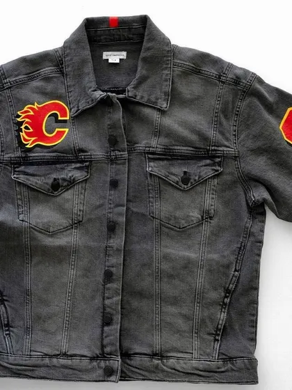 The front view of the custom denim jacket, showing the added flame and number patches that complete the theme. Every element is placed to contribute to the overall design.