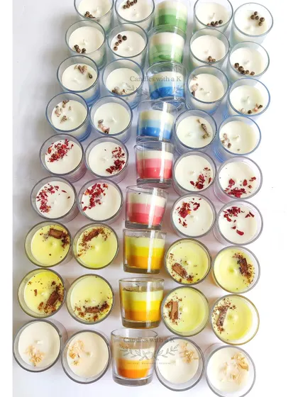 A beautiful assortment of votive jar candles, including layered styles and peony toppers, created for a housewarming gift box.