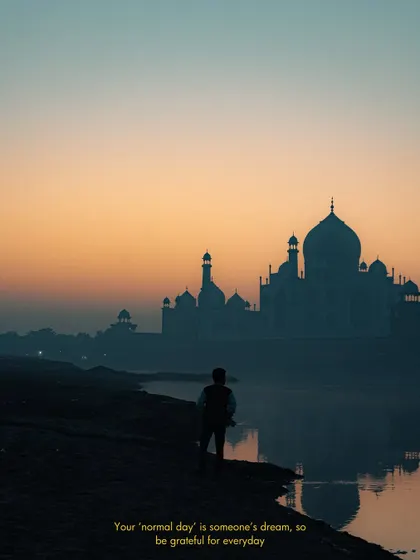 Capturing an iconic landmark like the Taj Mahal requires a unique perspective. This shot, taken at sunrise from across the river, uses the silhouette and the soft morning light to create a serene and timeless travel photograph.