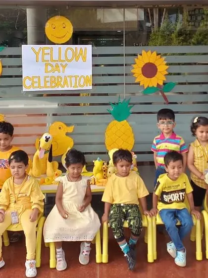 A group of nursery students in their yellow outfits, ready for a day of fun and learning about the color yellow.