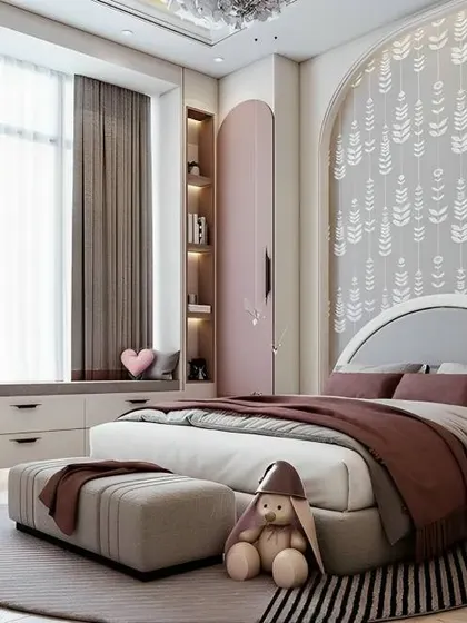 An elegant girl's bedroom with a large arched headboard and a cozy window seat with built-in storage. The soft pink and grey color scheme is sophisticated and timeless.