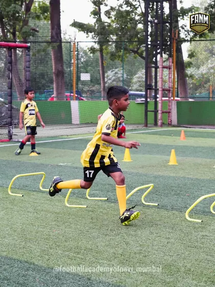 A player navigates a speed and agility course, weaving through hurdles and cones. This type of conditioning drill is a core part of my training program to build explosive players.