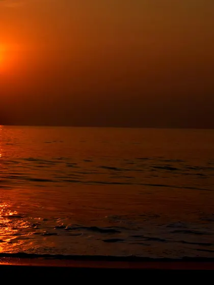 A fiery sunset over the ocean in Gokarna, a daily spectacle that I ensure my teams get to experience.