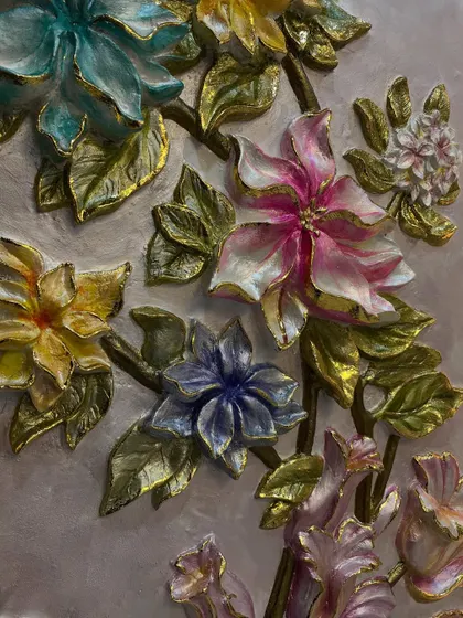 Another detail shot of the vibrant, multi-colored flowers, each one uniquely sculpted and painted.