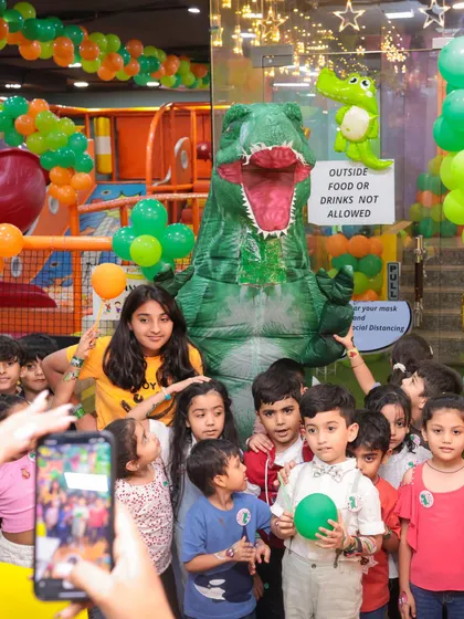 This is what pure party excitement looks like. We hosted a dinosaur-themed birthday bash, complete with a T-Rex mascot that had all the kids roaring with joy. I can bring any theme to life for your child's special day.