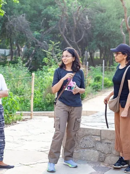 Our volunteer guide, Charu Govil, engages with participants during a community walk, sharing her passion and knowledge about the local ecosystem.