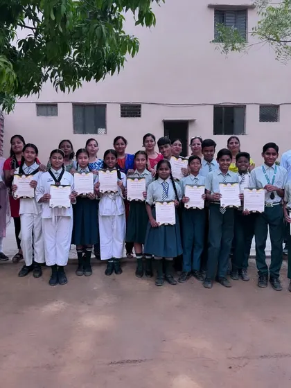 A group of proud students holding their certificates after completing a training program. Recognizing their hard work is an important part of building their self-esteem.