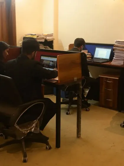 My team of junior advocates diligently working on case files. It takes burning the midnight oil to succeed in this profession.