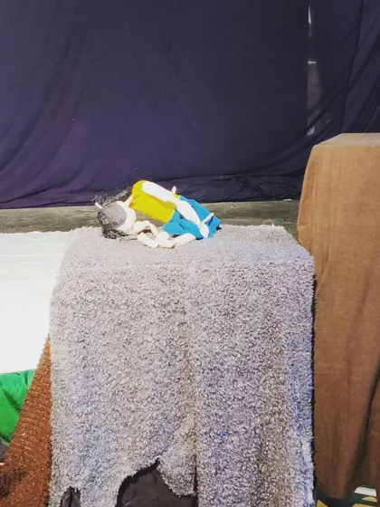 A puppet resting on the stage during a break in rehearsals. Our studio is always buzzing with creative energy.