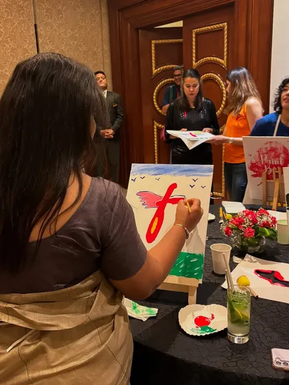 A participant at the CNBC "Future Female Forward" event, deeply engaged in her painting. It was an honor to be part of such a meaningful gathering.