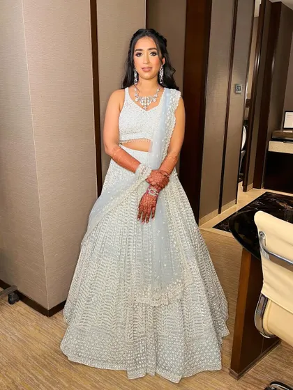 Sanskriti looks poised and radiant, ready for her engagement party. The makeup is designed to last all night while looking fresh.