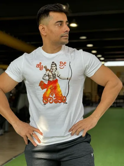 A member stands proudly in our gym. Our trainers work to build not just physical strength but also the confidence that comes with achieving your fitness goals.