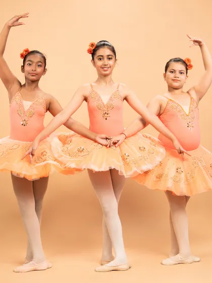 Dressed as blooming flowers, these dancers are ready for 'The Waltz of the Flowers' from The Nutcracker. Their poses capture the delicate beauty of nature's cycle, from bud to full bloom.
