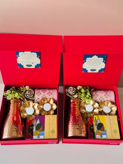 A pair of our red Diwali hampers, perfect for gifting to clients or employees. We ensure every box is packed to perfection.