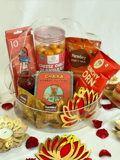 The clear acrylic basket allows the vibrant red packaging of the products to take center stage.