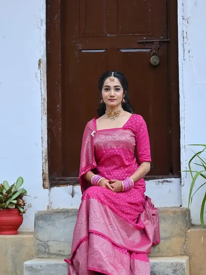 A seated portrait of the bride, showcasing her elegant and simple look for the pre-wedding function.