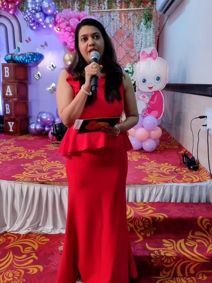 On stage with the mic, guiding the event and making announcements. I ensure a smooth flow so you can relax and enjoy your party.