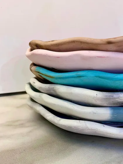 A stack of my live-edge trays in various colors, looking real cute all stacked up.