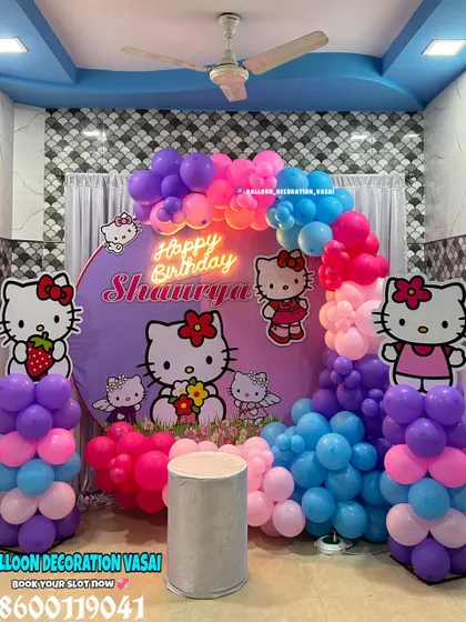 A bright and colorful Hello Kitty theme for Shaurya's 5th birthday. The setup features a custom backdrop and balloon pillars with cute character cutouts.