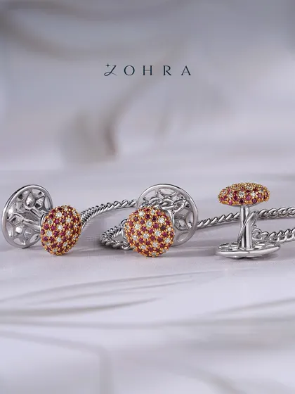 For the man who appreciates fine detail, I design accessories that make a statement of character. These custom cufflinks are crafted in white gold, featuring a dome of hand-set rubies and diamonds. They are more than an accessory; they are a personal signature of confidence and style.
