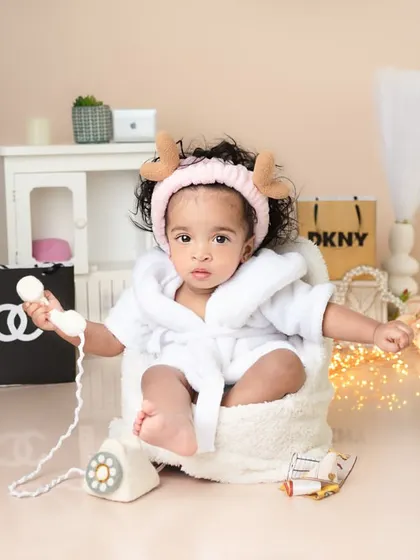 This little diva is on the phone, making important calls. Themed sessions like this are a great way to have fun and create truly unique and memorable portraits.