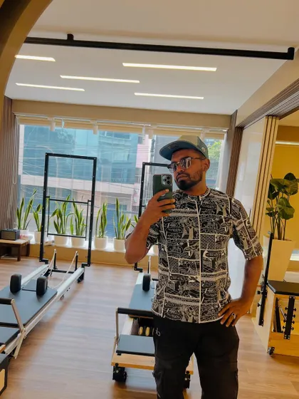 A quick selfie in the studio. You can see the reformers and the bright, open layout of our training space.